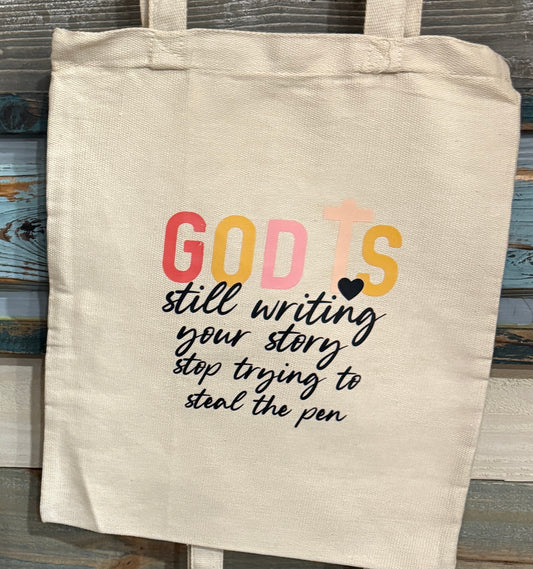 God is Still Writing Your Story Tote